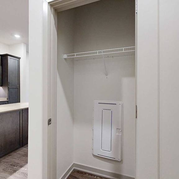 Thumbnail 25 of 25 a storage closet with a built-in wire shelf