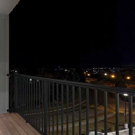 Thumbnail 13 of 25 a balcony with a metal railing and a window into the bedroom
