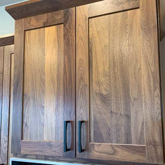 Thumbnail 3 of 26 a kitchen with neutral wooden brown cabinetry