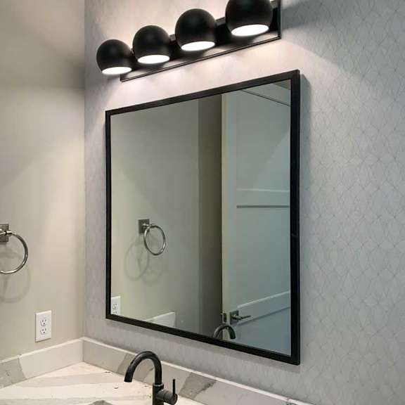 Thumbnail 16 of 26 a bathroom vanity sink with a square mirror and overhead lighting