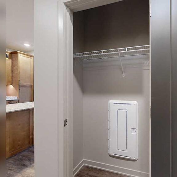 Thumbnail 26 of 26 a storage closet in the front entry with a built-in wire shelf