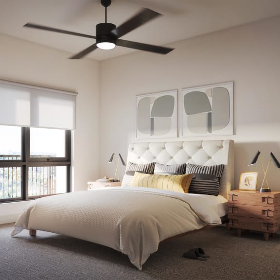 Thumbnail 3 of 3 a bedroom with a bed and a ceiling fan in apartment at Brynwood at Wilderness Ridge