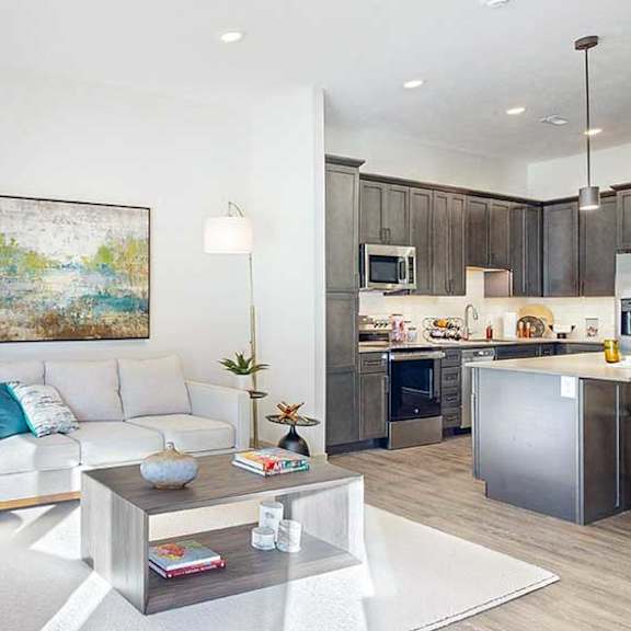 Thumbnail 13 of 26 a furnished living room with midcentury modern furniture and plenty of natural light