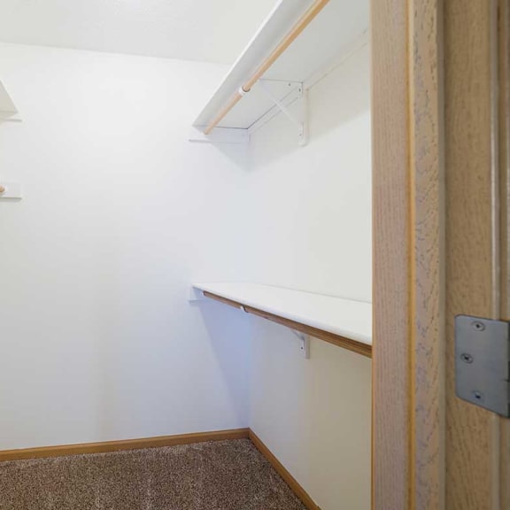 Thumbnail 19 of 26 a walk in closet in the primary bedroom of the Ponderosa duplex