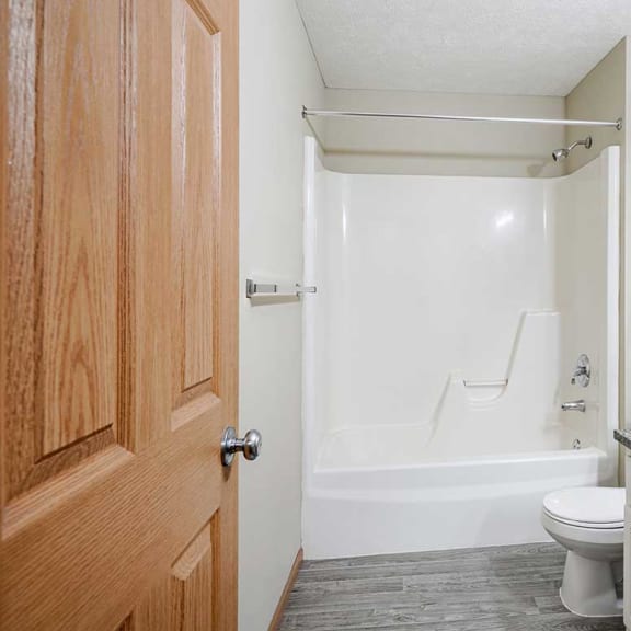 Thumbnail 22 of 26 a bathroom with a shower tub