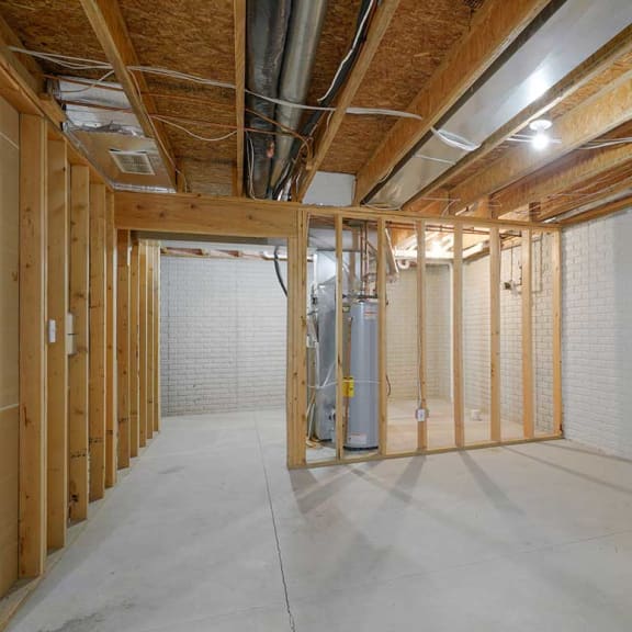 Thumbnail 26 of 26 an unfinished basement with a wooden frame