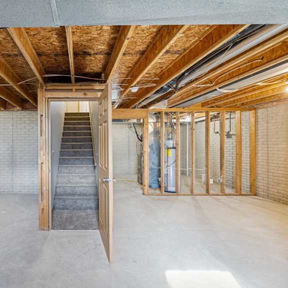 Thumbnail 33 of 54 A room with a wooden ceiling and a concrete floor.