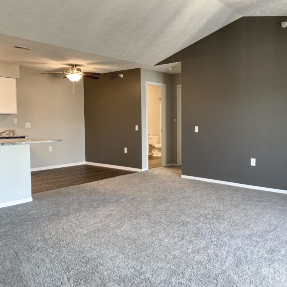Thumbnail 6 of 22 Spacious living room and dining room in the renovated style at Eagle Run Apartments in Omaha Nebraska