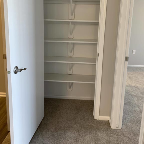 Thumbnail 4 of 22 Pantry space and shelving at Eagle Run Apartments in Omaha Nebraska