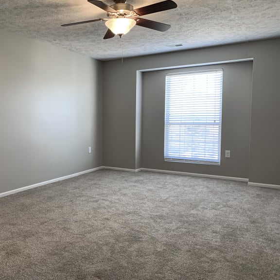 Thumbnail 9 of 22 Carpeted bedroom with walk in closet at Eagle Run Apartments in Omaha Nebraska