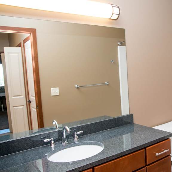 Thumbnail 12 of 14 A bathroom with a sink, toilet, and bathtub.