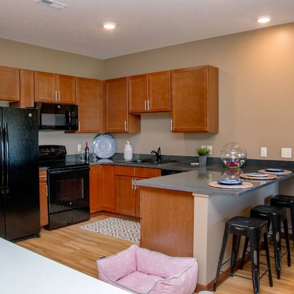 Thumbnail 3 of 14 U-shaped kitchen with black appliances