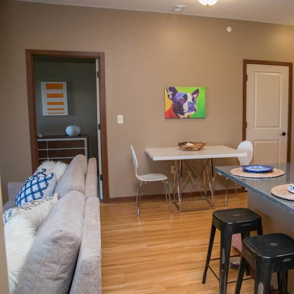 Thumbnail 7 of 14 A dining area with a white table and chairs.