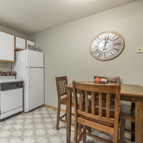 Thumbnail 5 of 9 Traditional style kitchen with white cabinets and wooden trim