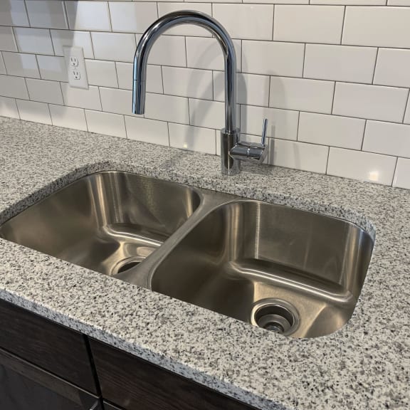 Thumbnail 4 of 16 Stainless steel undermount sink with a chrome faucet