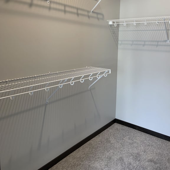 Thumbnail 13 of 18 Walk-in closet with shelving and rods in the Peace floorplan at Haven at Uptown