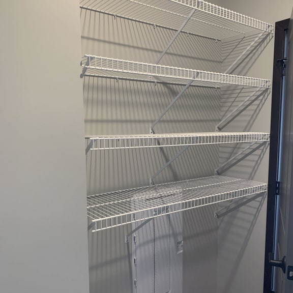 Thumbnail 14 of 18 Spacious walk-in closet with shelving in peace floorplan at Haven at Uptown