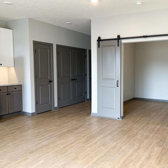 Thumbnail 6 of 17 Den or office with gray sliding barn doors