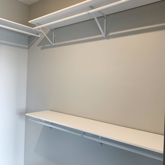 Thumbnail 14 of 17 Walk-in closet with shelving and rods in the Serenity floorplan at Haven at Uptown