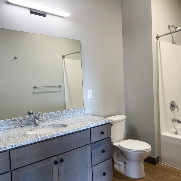 Thumbnail 9 of 17 Bathroom with light gray finish and granite counter tops