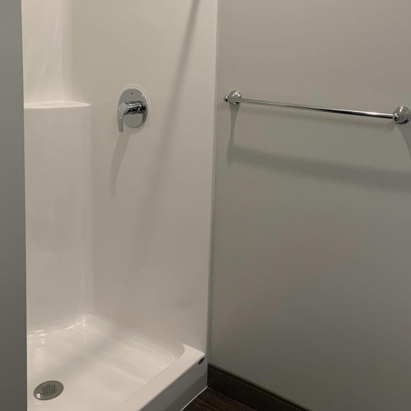 Thumbnail 11 of 12 Walk-in shower with curtain rod and towel rack near by at Haven at Uptown