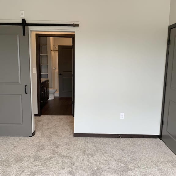 Thumbnail 8 of 15 Bedroom looking into pass through closet and connected bathroom