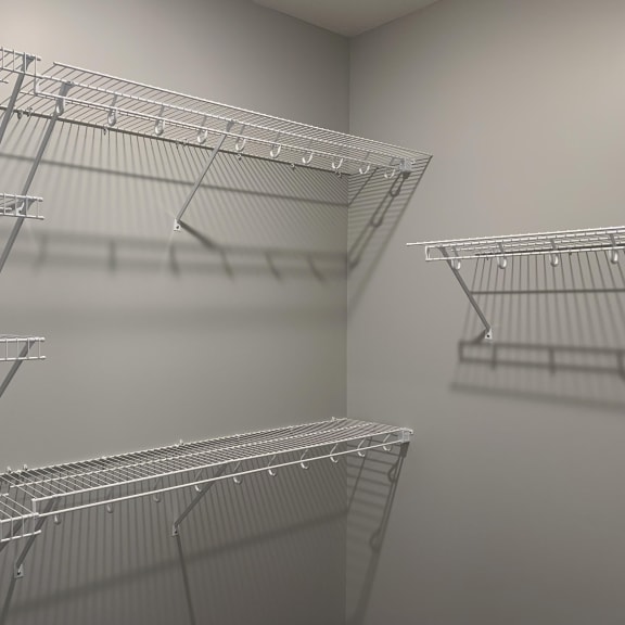 Thumbnail 23 of 23 Large walk in closet with wire shelving for clothing storage