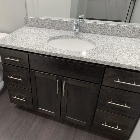 Thumbnail 21 of 23 Bathroom with cabinet for storage and light granite counters