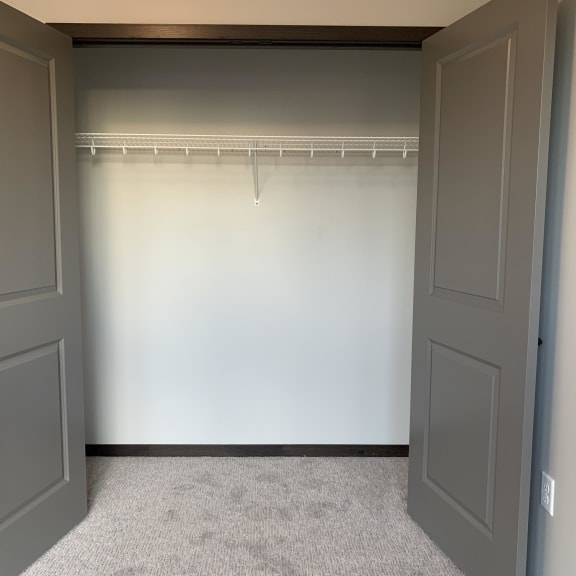 Thumbnail 10 of 18 bedroom closet with hanging and shelving space