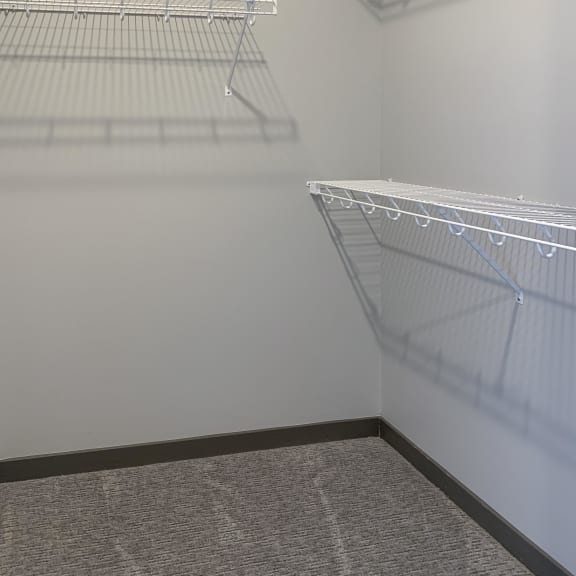 Thumbnail 11 of 16 Large walk in closet with plenty of shelving space at Haven at Uptown