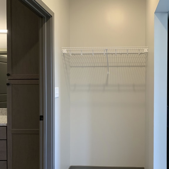Thumbnail 12 of 16 Walk in closet connected to master bathroom at Haven at Uptown