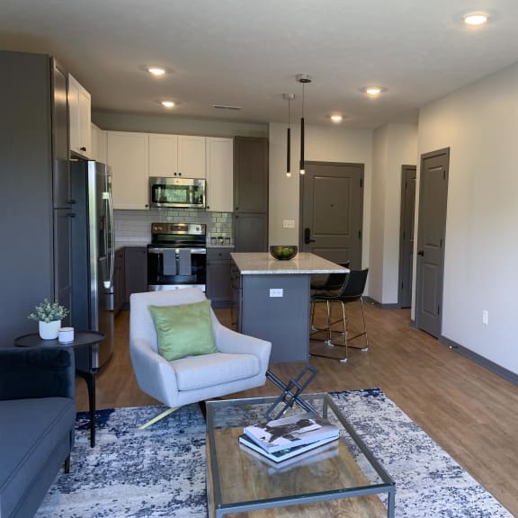 Thumbnail 10 of 19 Open concept living area with ample room and sunlight in the Bliss floor plan at Haven at Uptown in Lincoln.