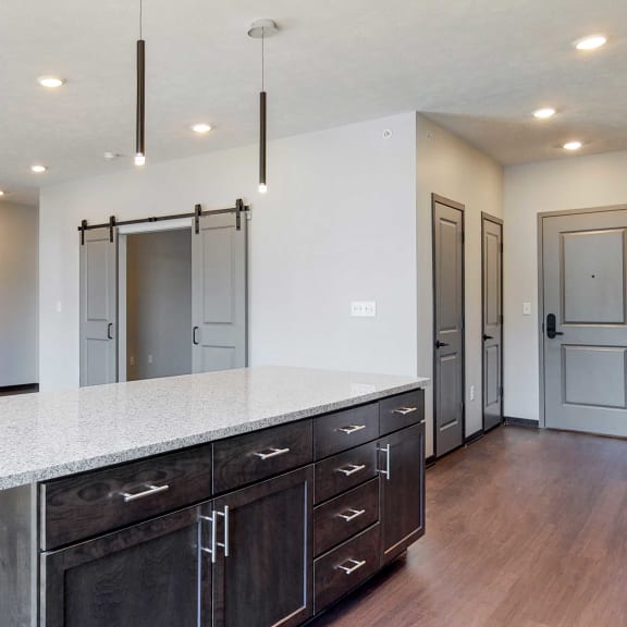 Thumbnail 4 of 17 Beautiful kitchen island which provides plenty of extra storage with the additional cabinet space provided at Haven at Uptown in Lincoln, NE