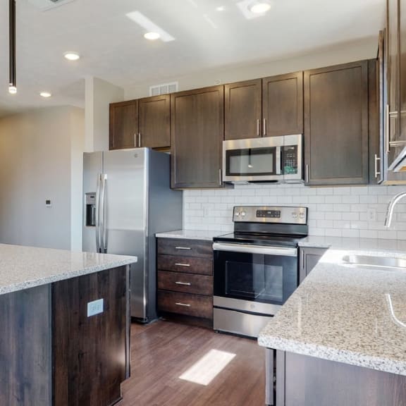 Thumbnail 2 of 18 View of mocha style finishes in Shine floor plan kitchen at Haven at Uptown in Lincoln, NE