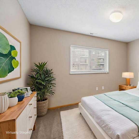 Thumbnail 3 of 15 Virtually staged bedroom with a large window, bedside tables, neutral walls, decorative artwork, and soft furnishings.