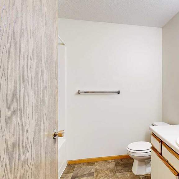 Thumbnail 18 of 29 Bathroom with single-sink vanity, wide mirror, and towel bar