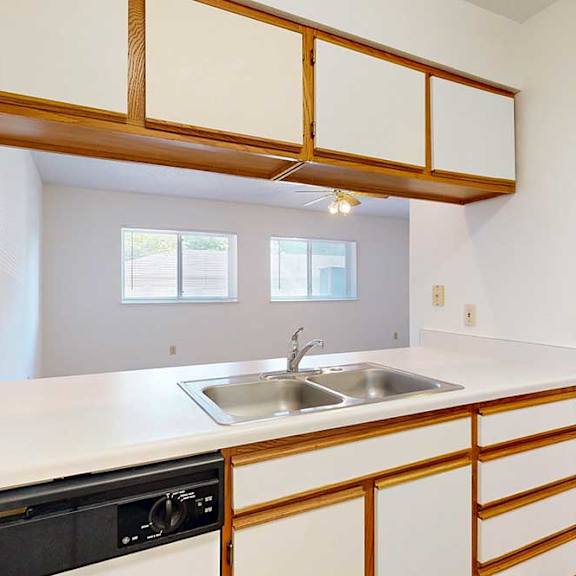 Thumbnail 5 of 29 Kitchen with a passthrough window countertop and a stainless steel sink