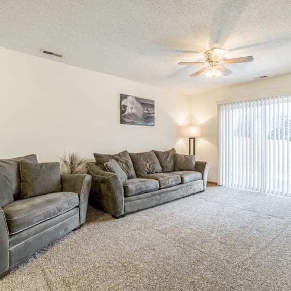 Thumbnail 7 of 10 Interiors-Living room in 1-bedroom apartment with walkout patio