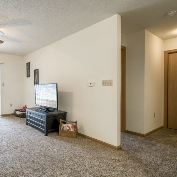 Thumbnail 5 of 10 Interiors-Living room in 1-bedroom apartment with walkout patio