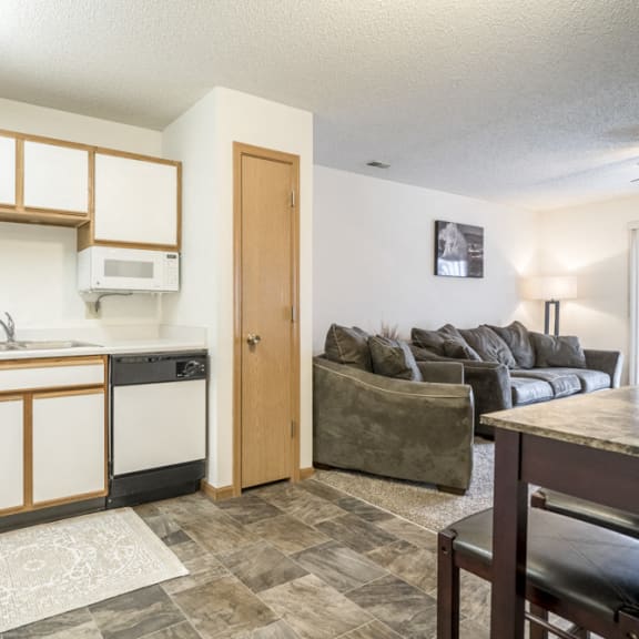 Thumbnail 3 of 10 Kitchen with updated flooring and white and wood cabinetry