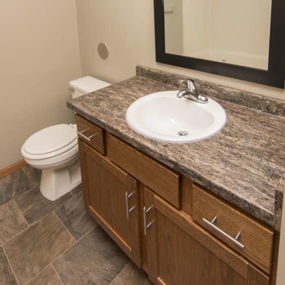 Thumbnail 9 of 10 a bathroom with a sink and a toilet