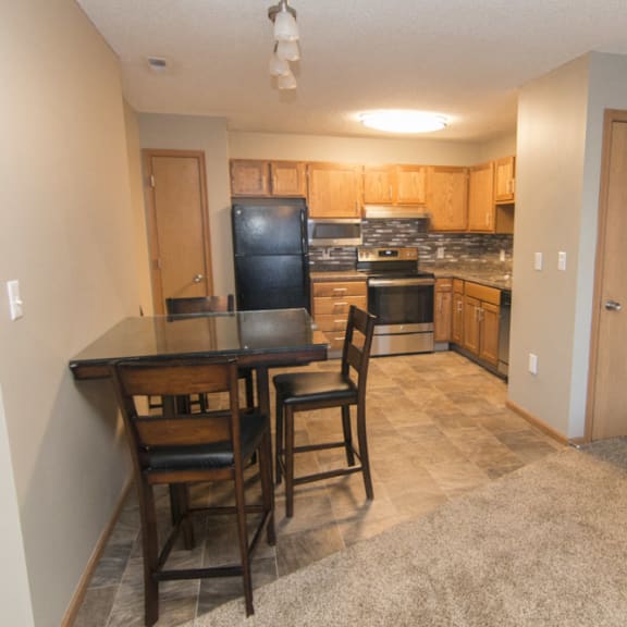Thumbnail 2 of 10 Attached dining area looking into corner kitchen at Highland View