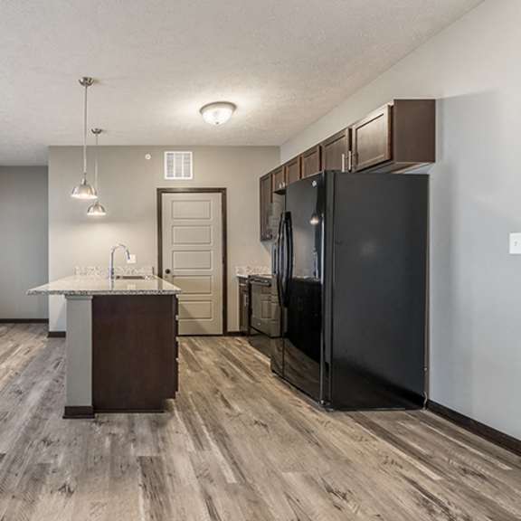 Thumbnail 2 of 9 Kitchen with granite countertops and lots of cabinet space at North Pointe Villas