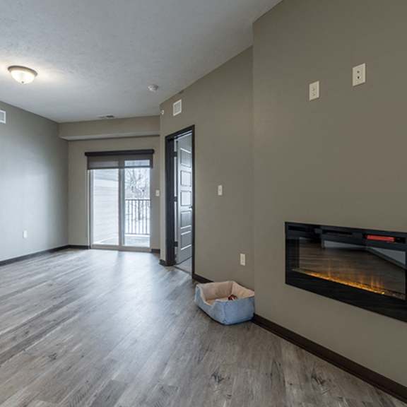 Thumbnail 3 of 12 Open floor plan living space including a fireplace at North Pointe Villas in Lincoln NE