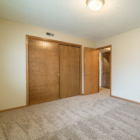 Thumbnail 6 of 15 Spacious bedroom with closet space at Fountain Glen Apartments