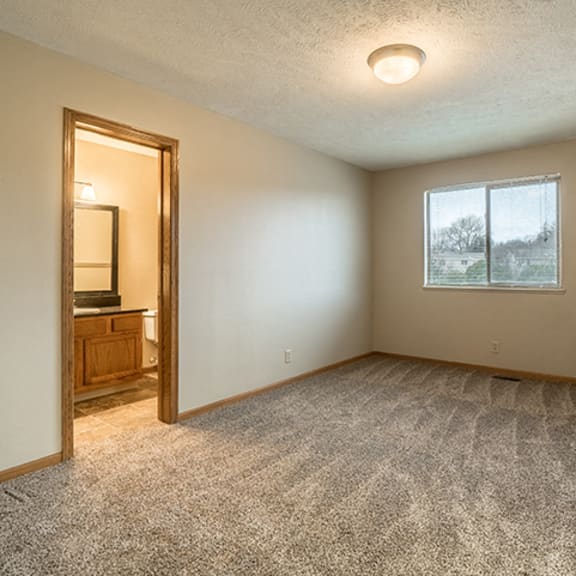 Thumbnail 14 of 15 Bedroom with attached bathroom at Fountain Glen Apartments