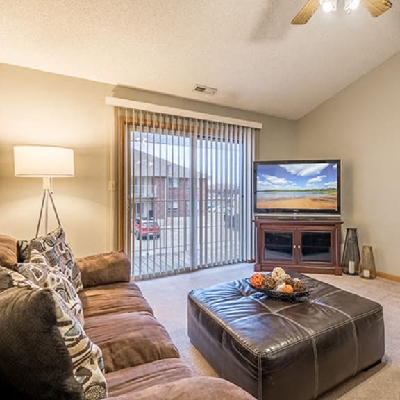 Thumbnail 3 of 9 Living space with sliding doors at Fountain Glen Apartments