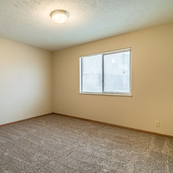 Thumbnail 7 of 15 Large bedroom with natural light at Fountain Glen Apartments