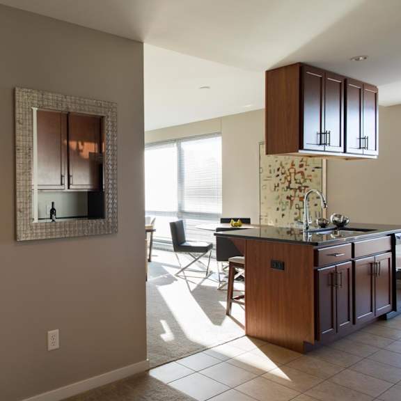 Thumbnail 6 of 10 view of door into bedroom and kitchen island and living room