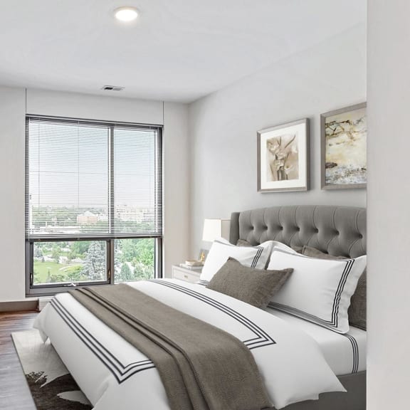 Thumbnail 8 of 22 Spacious bedroom with floor-to-ceiling windows a 2 bedroom penthouse floor plan Midtown Crossing Apartments Omaha